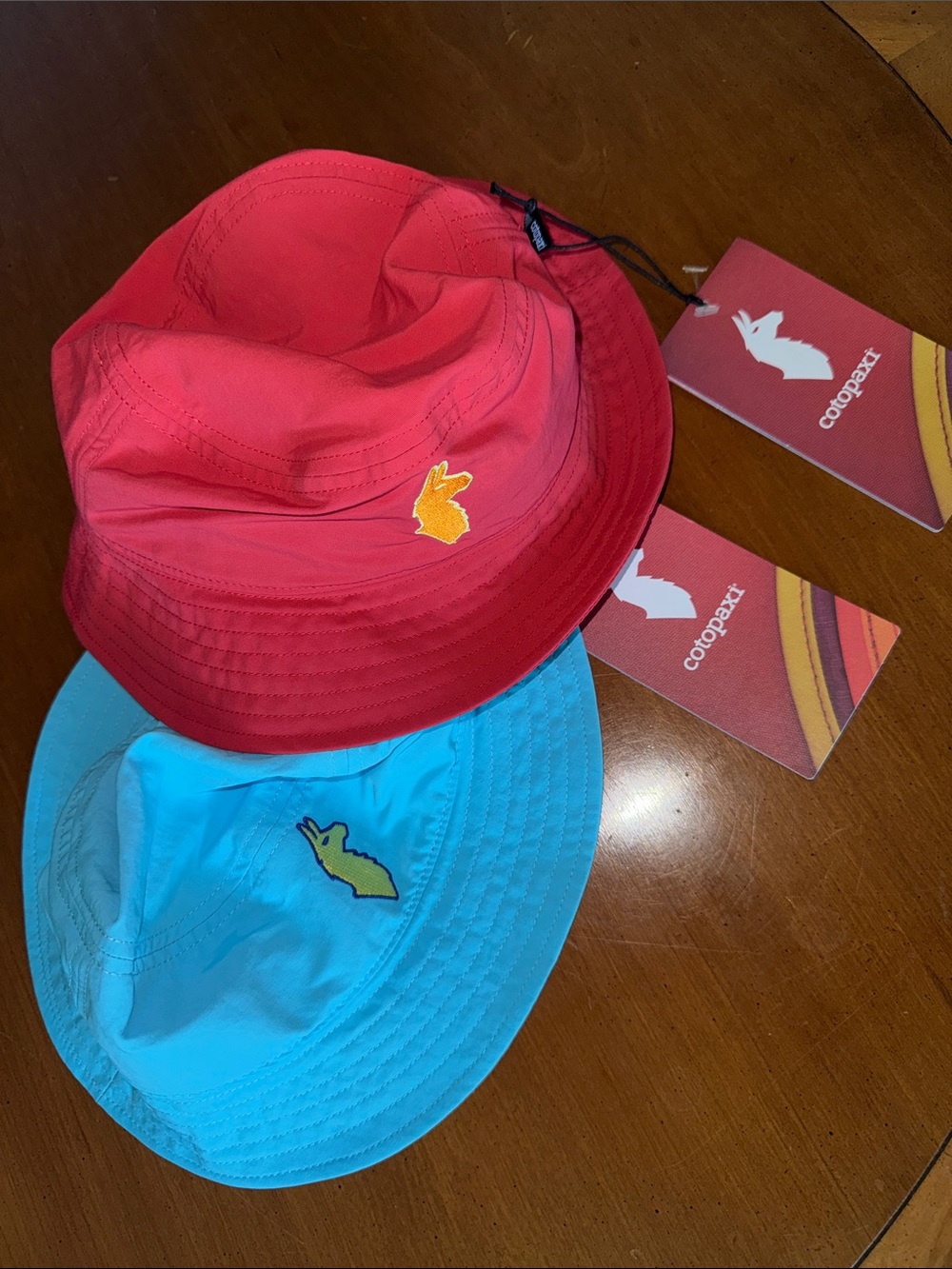 cotopaxi Two-Pack Bucket Hats - ‘Strawberry Red & Blue Sky Light Blue NWT!